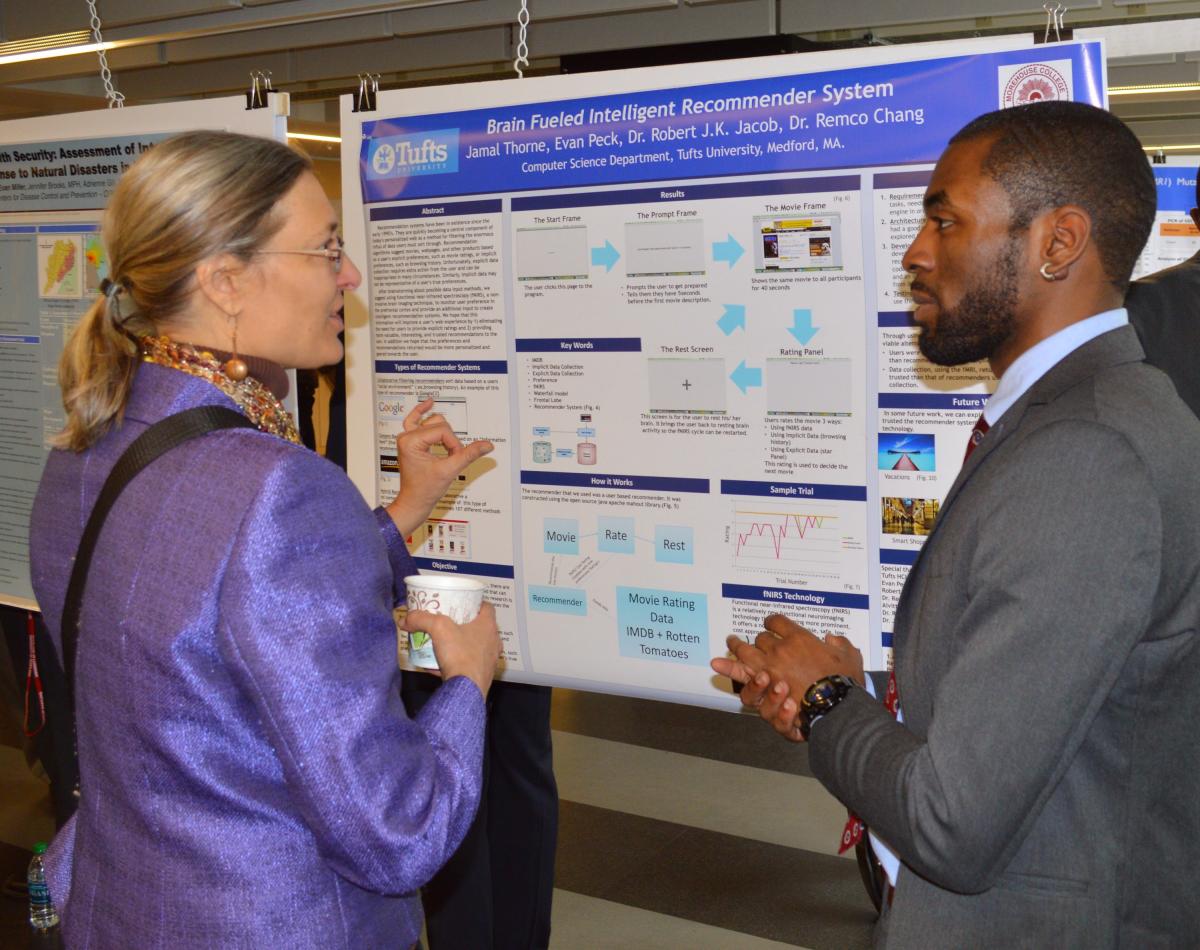 Jamal Thorne (right), Morehouse College '15 explains his research 