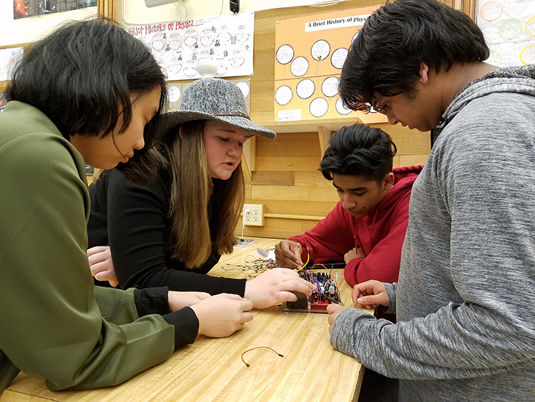 Students at Juanita High School working on circuitry unit