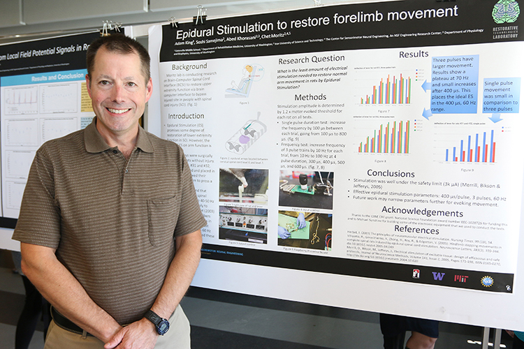 RET participant, Adam King, with his research poster at the CSNE