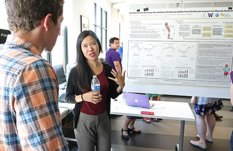 REU participant, Wing-Sum Law, answering questions about her research project poster (shown)